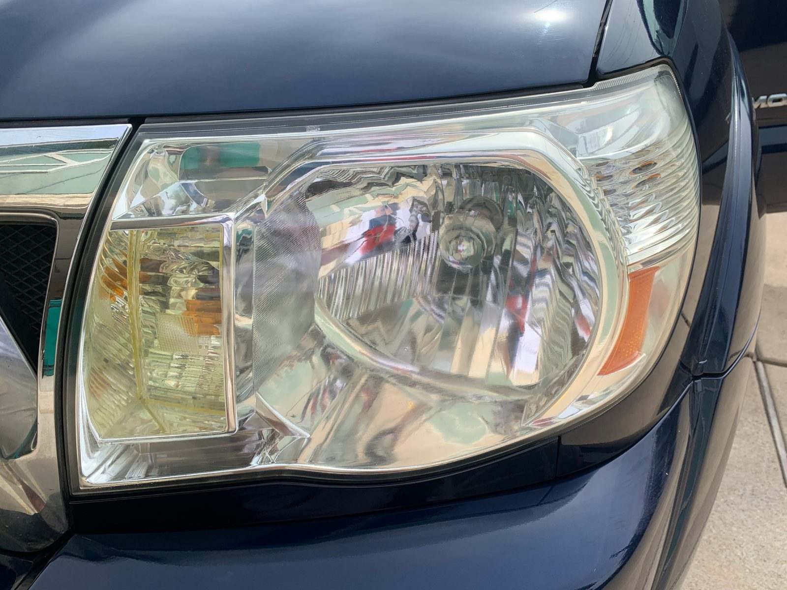 A restored headlight lens, clear and polished after treatment